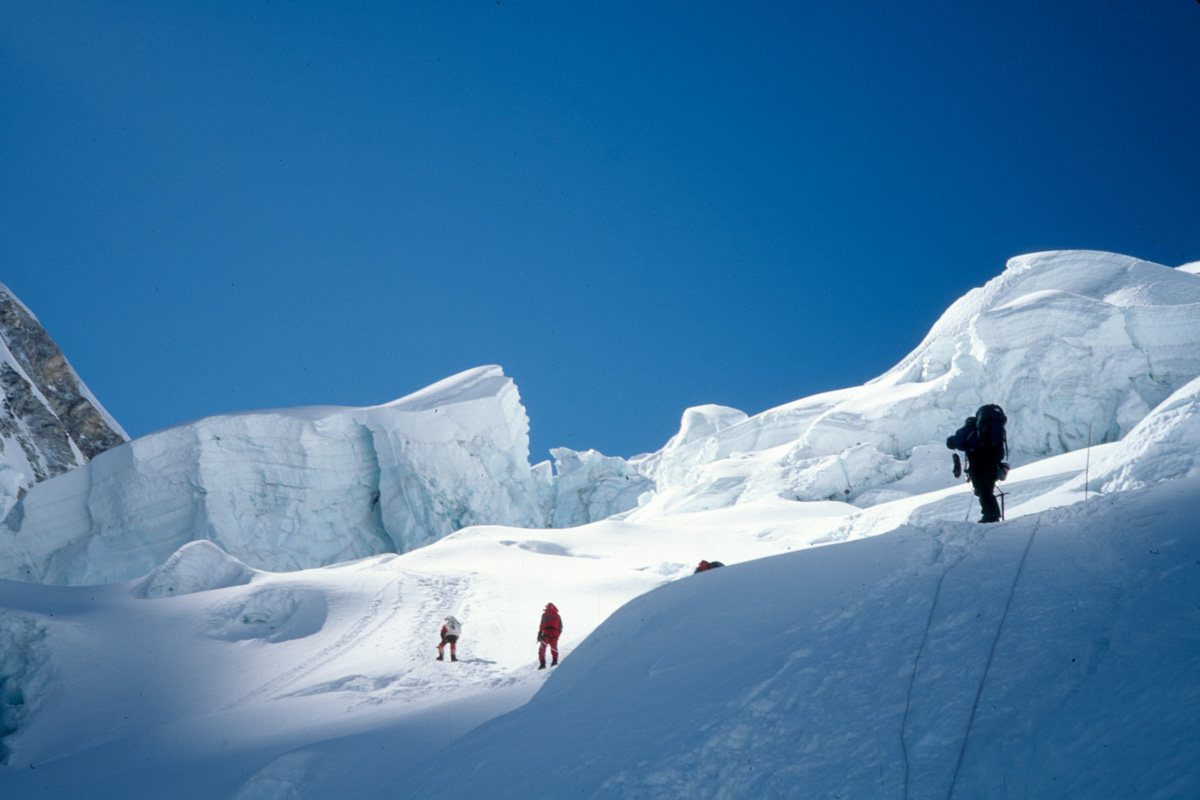 A high alpine trail with snowy peaks in the background